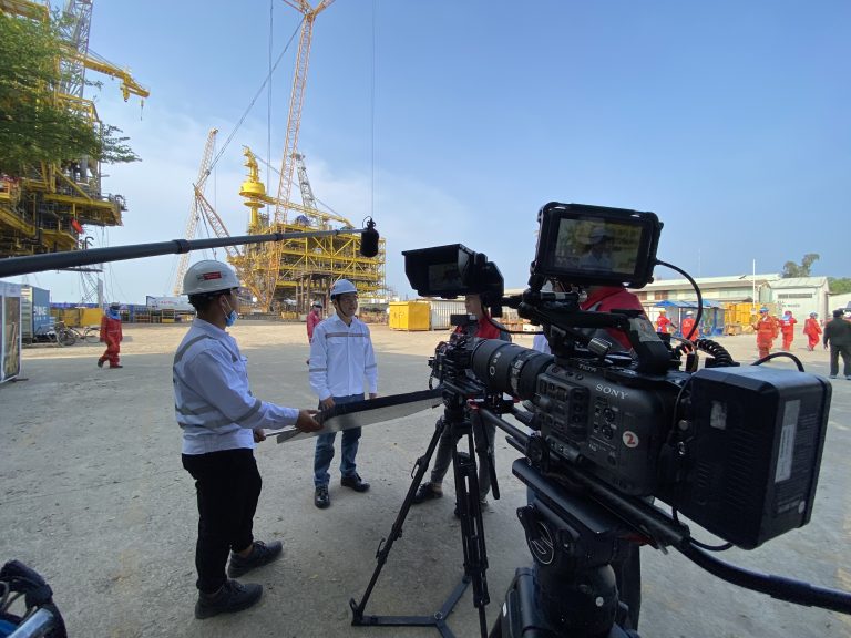9G Pictures crew filming in protective equipment at an offshore fabrication yard, Vung Tau